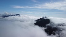  cloudy landscape. Aerial view over clouds in hilly landscape, fluffy cloud
