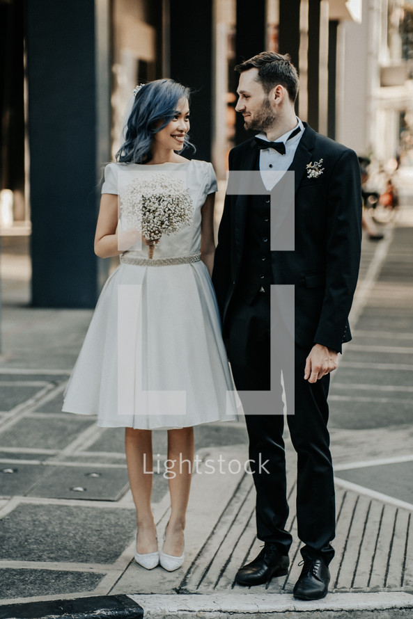 bride and groom in a city 