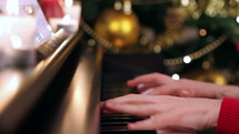 person playing a piano at Christmas