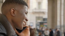 young man talking on a cellphone 