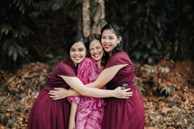 portrait of a bride and her bridesmaids getting ready for her wedding 
