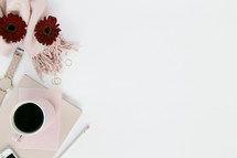 stationary, pencil, watch, iPhone, red gerber daisies, white background, nail polish, pink scarf, gold rings, pencil 