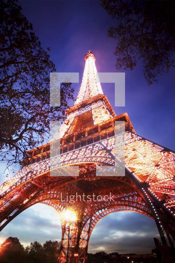 Low angle view of the Eiffel Tower at dusk, Paris. France.- for editorial use only.