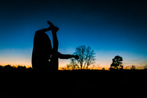 silhouette of a girl stretching 