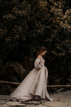 a woman walking in an elegant gown 