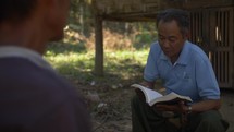 Asian Missionary Giving Bible Study In The Jungle