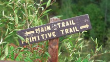Hiking Trail Sign with Bushes