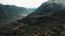 Aerial drone shot of Lush Mountains And Valley At Cayambe Coca National Park In Papallacta, Ecuador.