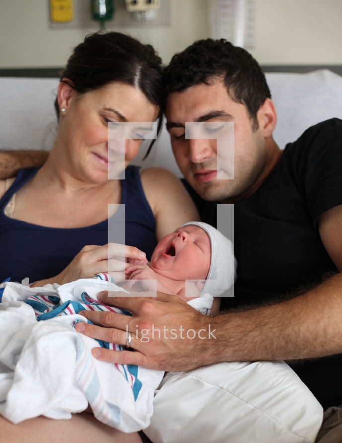 couple holding their newborn son