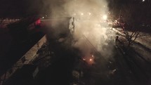 Aerial Drone Shot Around A Burning House. Dark Smoke