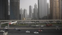Rush hour, busy traffic, cars, vehicles on Dubai highway by metro train in United Arab Emirates in Middle East. 