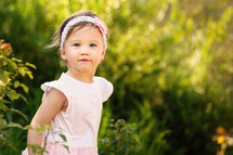 toddler girl standing outdoors  