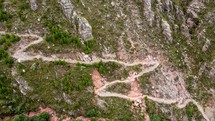 Aerial shot drone flies down toward Inca Trail