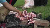 Sheep meat being cut and prepared for middle eastern, Muslim religious holiday or celebration Eid Al Adha in cinematic slow motion by muslim man.