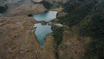Aerial View Of Laguna Baños On The Foothill Of Mountain In Cayambe Coca Ecological Reserve In Napo, Ecuador.