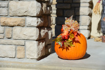 pumpkin by a front door 