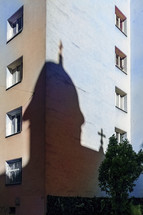 A church tower - shadow on a residential building.
