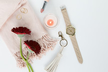 gerber daisies, watch, keychain, pink, red, rings, gold, jewelry, white background, feminine, lipstick, scarf 