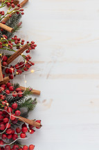 red berries and Christmas greenery on a white background 