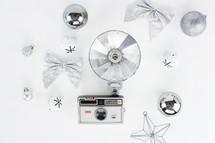 vintage camera and silver Christmas decorations 