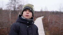 Young boy on nature walk 
