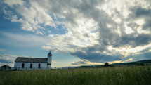 clouds in the sky over a rural country church 