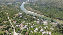 Drone flyover Historic village of Pocitelj by Neretva river, Bosnia and Herzegovina