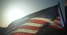 American flag in sunset blowing in slow motion