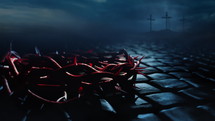 Crown of thorns placed into a courtyard paved with cubic stone. The storm and the three crosses on Calvary Hill can be seen in the background. Copy space for text or image.
