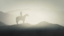 Female Warrior Sitting on a Horse in Mountain terrain