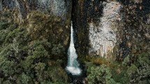 Cayambe Coca Reserve Hike With Waterfall In Andean Mountains Near Papallacta, Ecuador. Aerial Pullback	