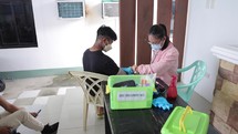 Asian Nurse Monitoring Patients Blood Pressure