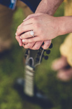 couples hands on a guitar 