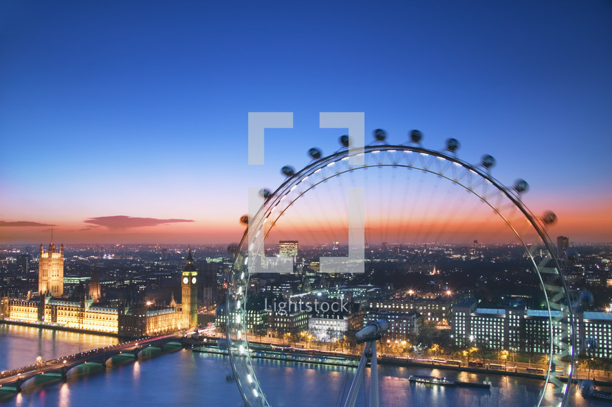 Elevated view of the London Eye and the Houses of Parliament at sunset, London. England.- for editorial use only 