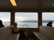 woman sitting on a ferry boat 