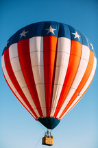 A hot air balloon in the colors of the United States flag.