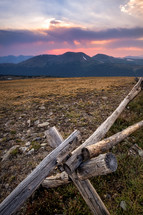 rustic fence high in the Rocky Mountains at sunset. Colorado, USA