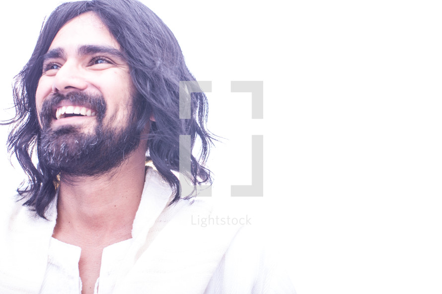 A smiling Jesus with a white background.