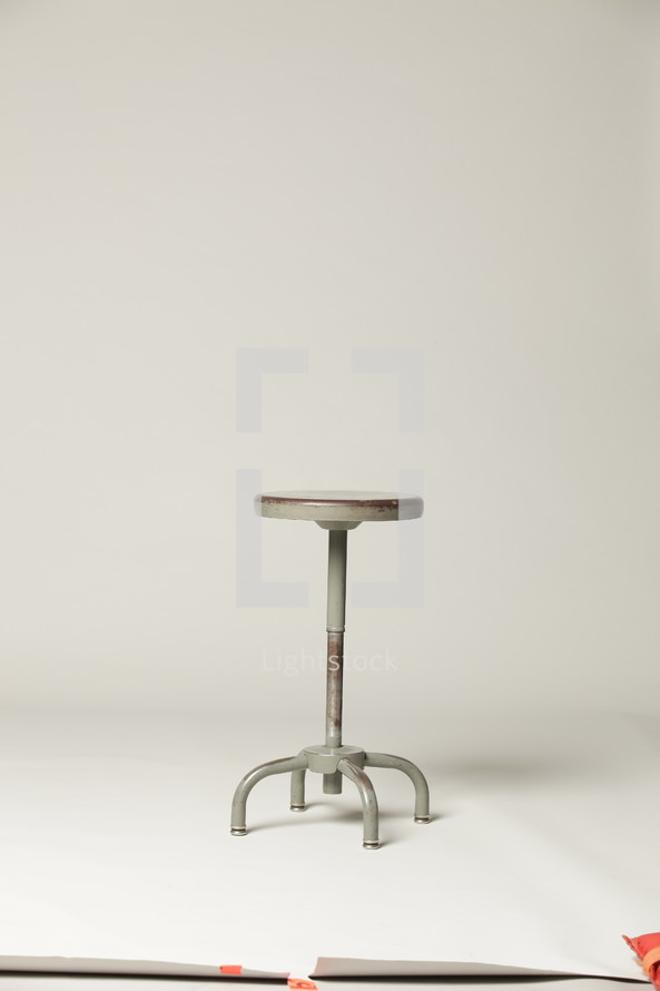 empty stool in a studio 