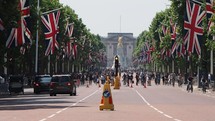 LONDON, UK - CIRCA JUNE 2018: Union Jack flags on the Mall for the celebration of the Queen birthday with Buckingham Palace in the background