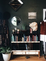home decor and books on a bookshelf 
