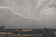 lightning in the sky over a town 