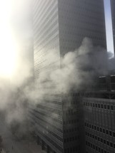 smoke and fog around skyscraper 