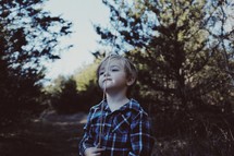 a boy holding a stick 