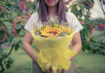 girl holding a bouquet of flowers 