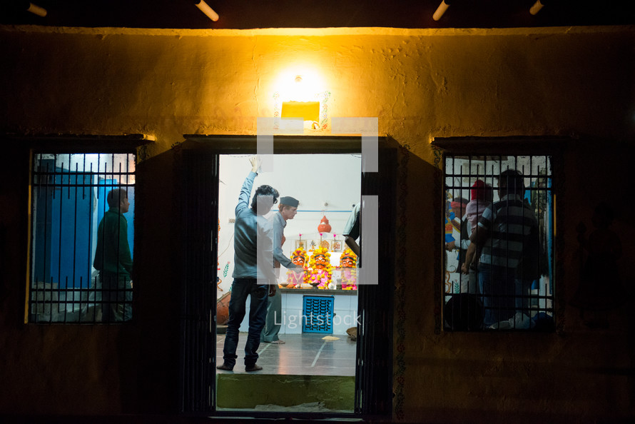 open door to a shop in India at night 