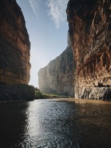 canyon river between tall cliffs 