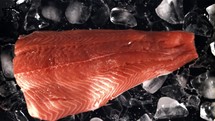 Salmon fillet with ice. Filmed is slow motion 1000 fps.