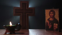 Close-up of Holy Cross with Candle and Icon.