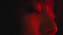 The girl's absent-minded eyes with red light